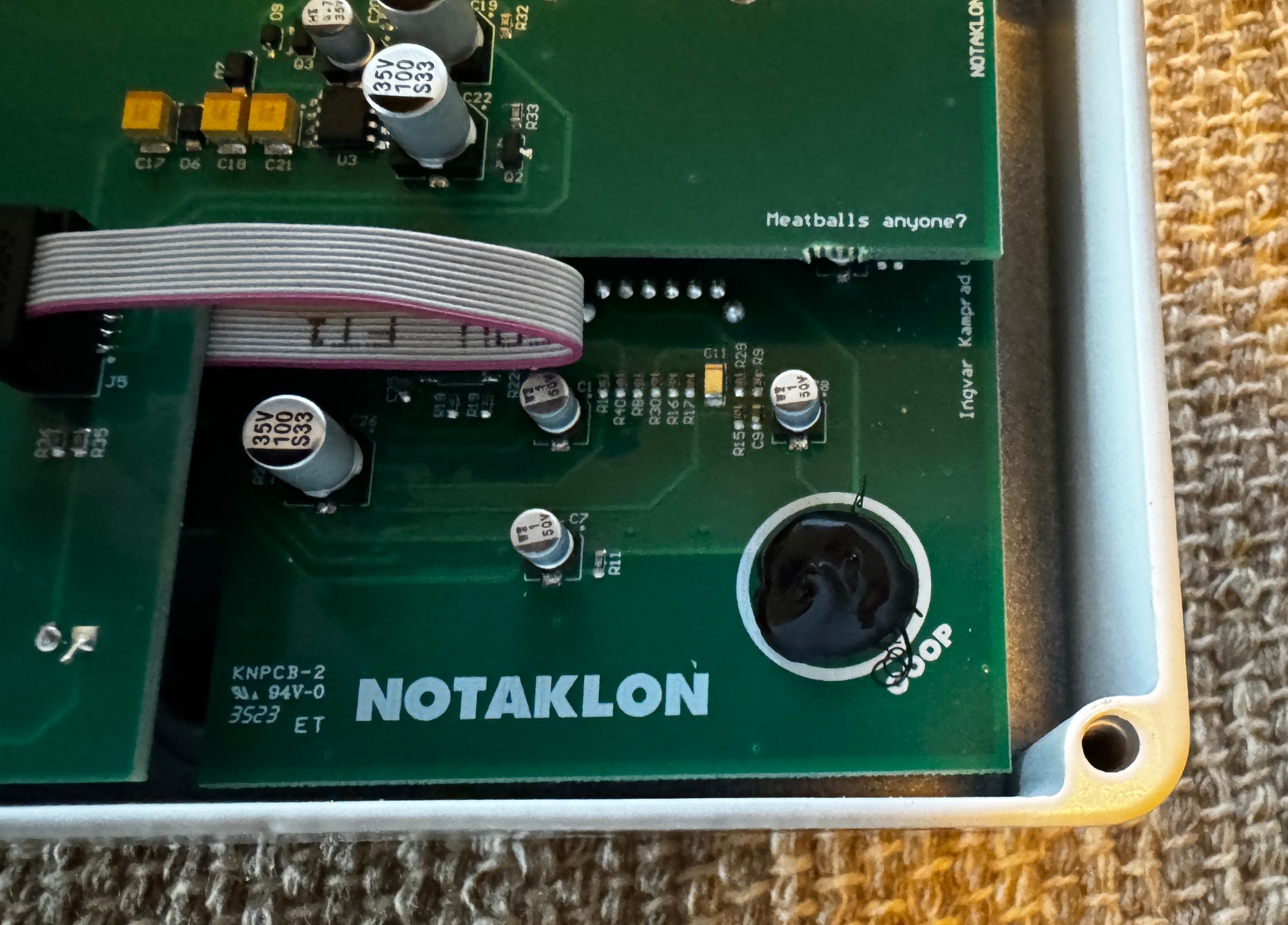 Inside the JHS Notaklön — circuit board with Meatballs anyone joke and the goop circle