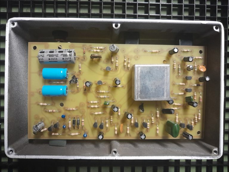 Inside the Vibe-Unit — hand-populated board with the sealed opto can